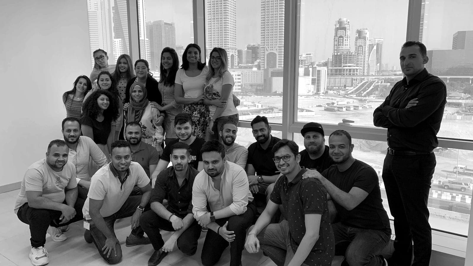 Salah Moustafa with a large team in an office overlooking the Dubai skyline, September 2019.